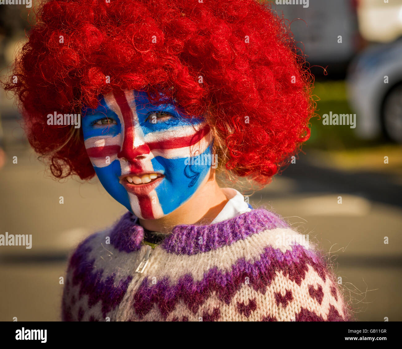 Girl with painted face, supporting Iceland in the UEFA Euro 2016 football tournament, Reykjavik, Iceland. Stock Photo
