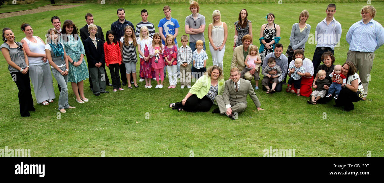 Louise Brown, 30, from Bristol, born 1978, and Alastair MacDonald, 28, from Glasgow, born 1979, who were the world's first female and male IVF babies (siitting on grass, centre) who are joined by 29 others born by IVF, each representing a year since 1978. Stock Photo