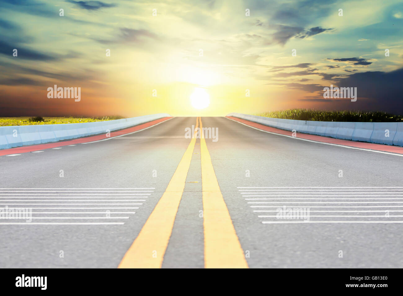 Highway and sky sunset background Stock Photo - Alamy
