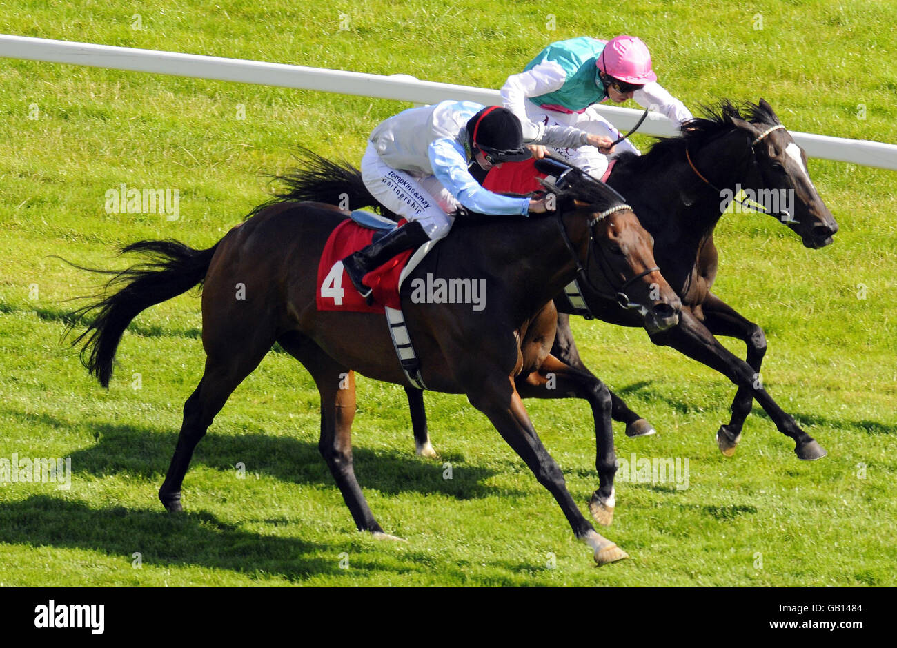 Passage of Time and jockey Ted Durcan (right) win The David Wilson Homes Steventon Stakes from Bankable and jockey Dane O'Neill at Newbury Racecourse. Stock Photo