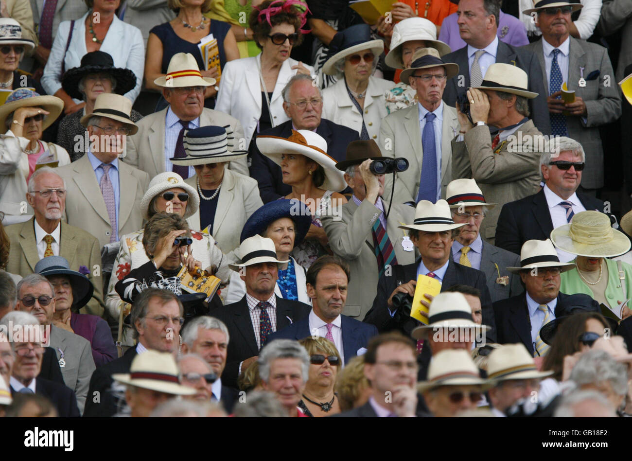 Goodwood members in the Richmond Enclosure watch Richard Hills winning