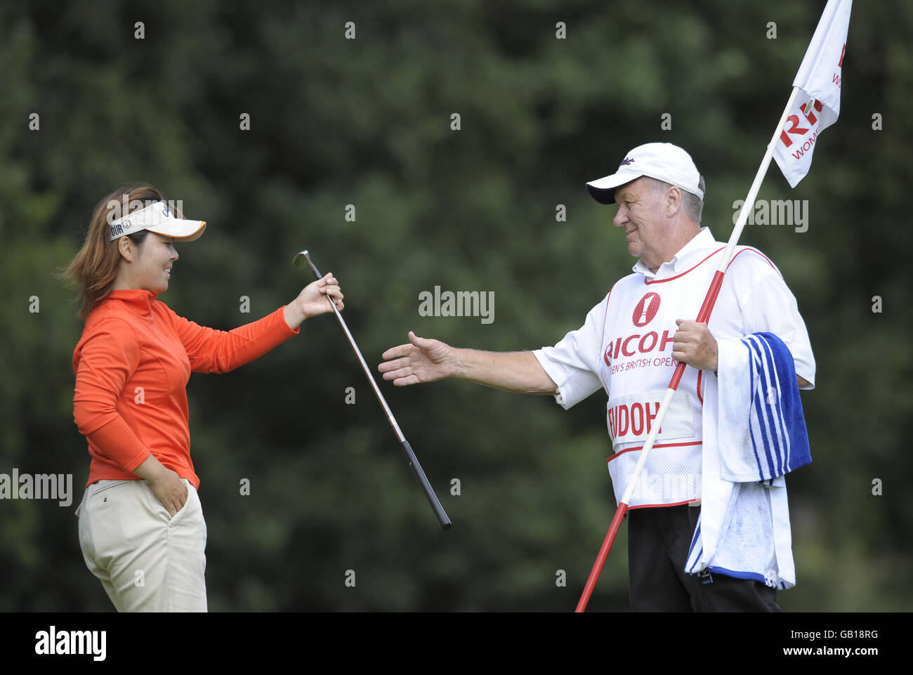 Japan's Yuri Fudoh hands her putter to her caddy Peter Coleman during ...