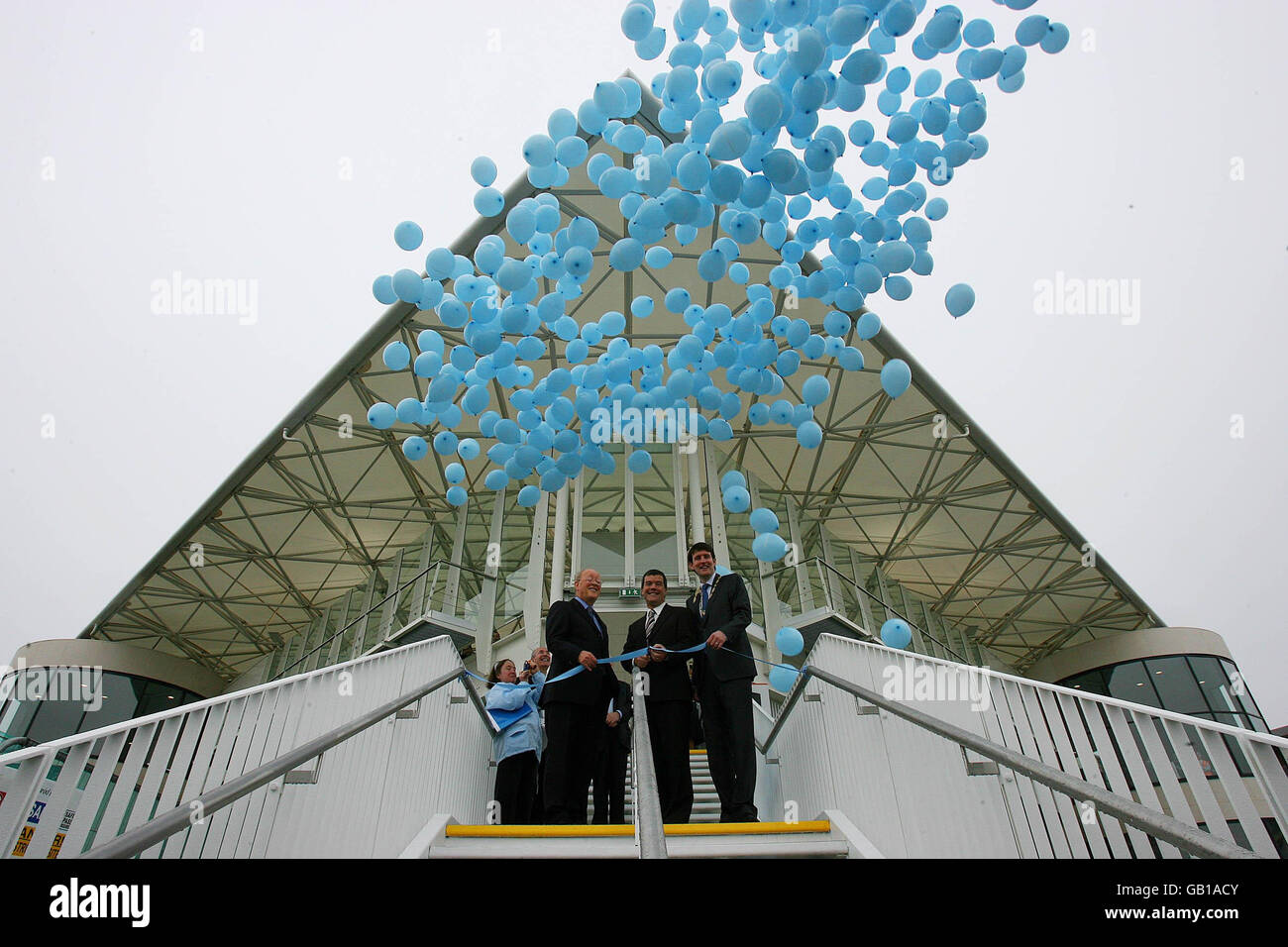 Minister for Transport Noel Dempsey with John Lynch Iarnrod Eireann Chairman (left) and Cllr. Charlie Ardagh (right) as he officially opens the new train station at Park West/Cherry Orchard Plaza in Dublin. The station is the latest phase of the Kildare Route Project. Stock Photo