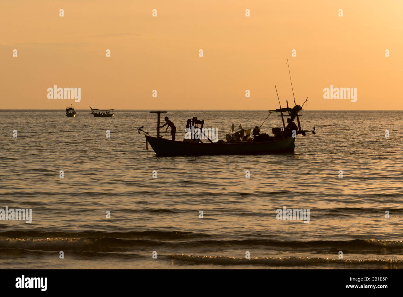 Silhouette of fishing boats Stock Photo - Alamy