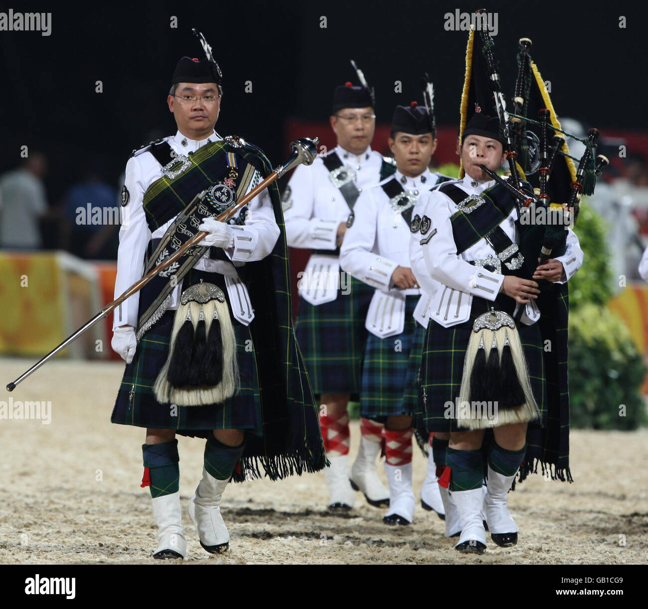 Entertainment prior to the evening dressage test at the Shatin Equestrian Centre, in Hong Kong, China. Stock Photo