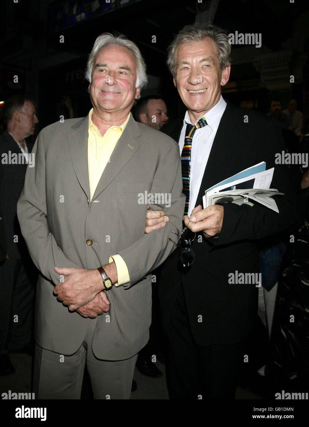 Playwright and director Richard Ayres (left) and Sir Ian McKellen leaving the press night of 'The Female of the Species' at the Vaudeville Theatre in central London. Stock Photo