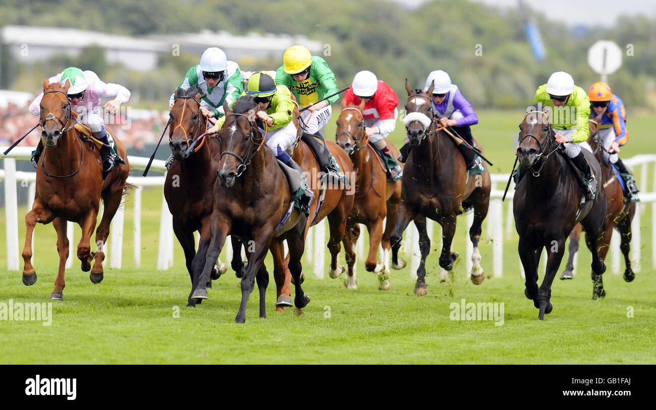 Horse Racing - Weatherbys Super Sprint Day - Newbury Racecourse. Intrepid Jack ridden by George Baker (black and green cap) goes on to win The Uplands racing Hackwood Stakes at Newbury Racecourse. Stock Photo