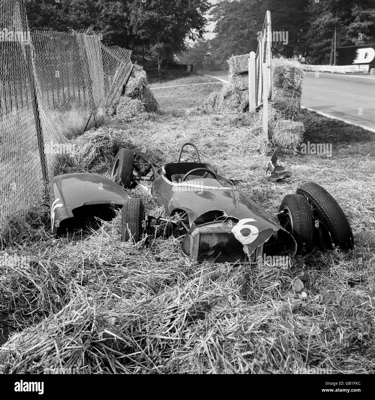 A Lotus-Ford, driven by Alan Rees, lies torn and battered beside the racing circuit at South London's Crystal Palace. The driver was unhurt. He was taking part in the September Trophy race for Formula Junior cars, organised by the British Automobile Racing Club. Stock Photo