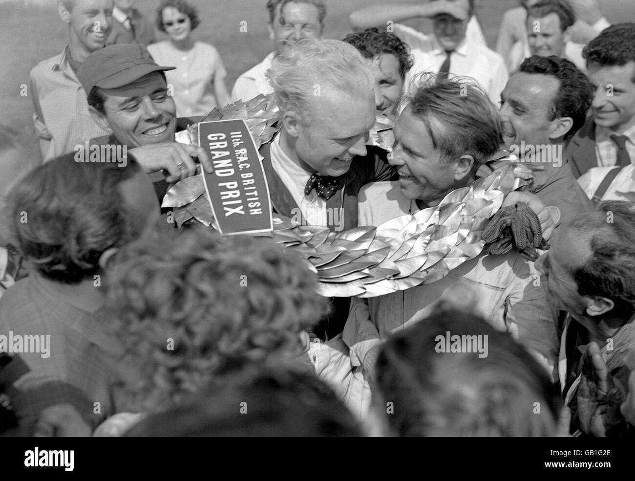 Peter Collins is congratulated by fellow Britain Mike Hawthorn after winning the British Grand Prix at Silverstone Stock Photo