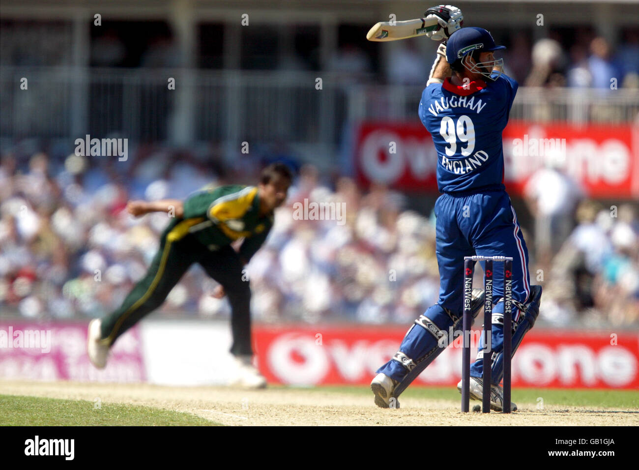 Cricket - The NatWest Challenge - England v Pakistan. England's captain Michael Vaughan (r) plays a shot off the bowling of Pakistan's Shoaib Akhtar (l) Stock Photo