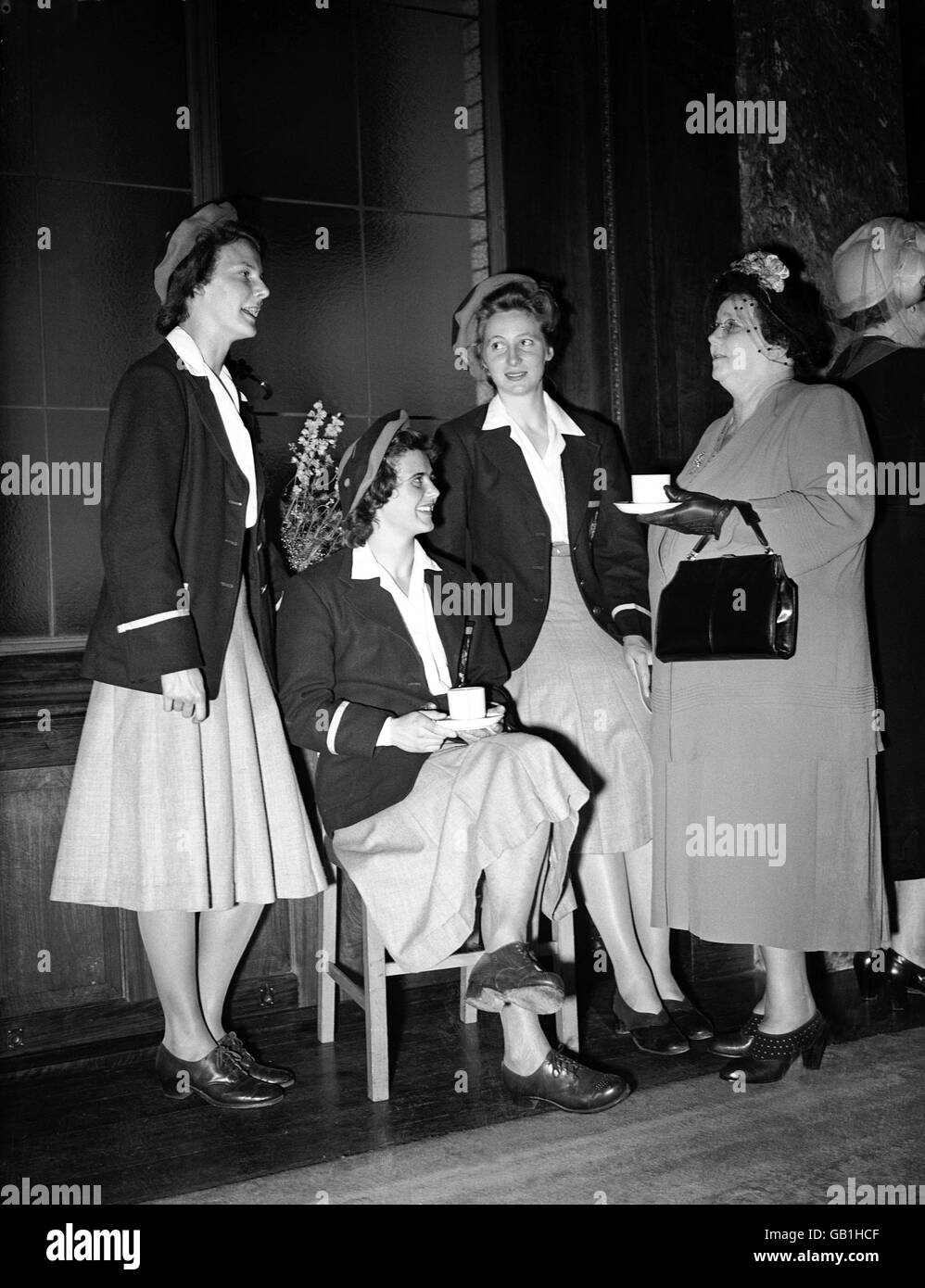 Mrs JA Beasley (r), the Australian High Commissioner's wife, talks to Australian athletes (l-r) Judy Canty, June Mason and Shirley Strickland. Stock Photo