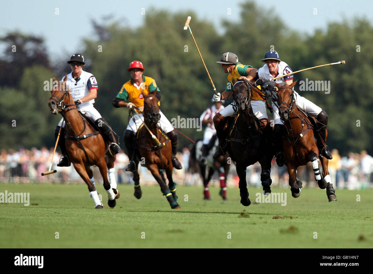 England and Australia battle in the Coronation Cup match at the Cartier International Polo at the Guards Polo Club in the Great Park in Windsor, Berkshire. Stock Photo