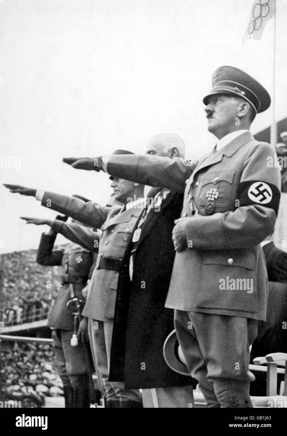 The Reichsfuhrer, Adolf Hitler, salutes the Olympic flag after officially declaring the Games open Stock Photo