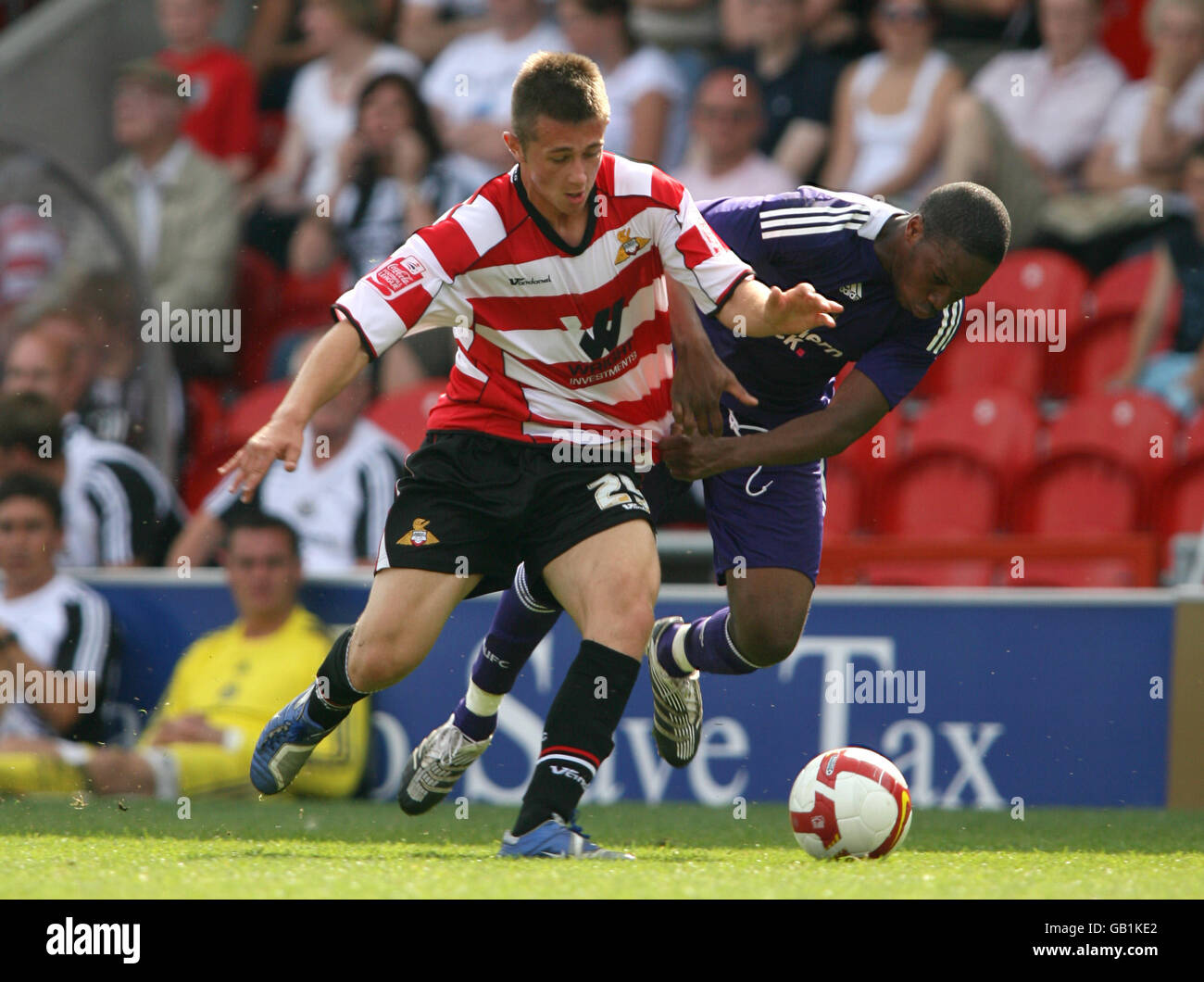 Doncaster Rovers' Waide Fairhurst battles for the ball with Newcastle United's Charles N'Zogbia. Stock Photo