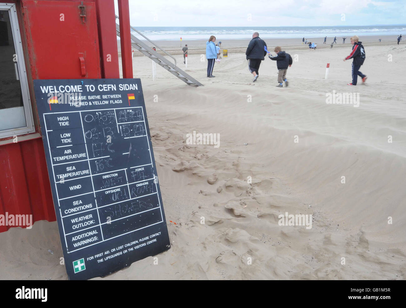 A general view of the beach at Cefn Sidan, near Burry Port, west Wales, where a 16-year-old boy died after a tunnel dug in sand dunes collapsed last night. Stock Photo