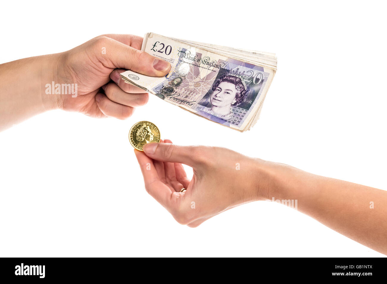 Closeup on hands exchanging gold coin on cash, isolated on the white