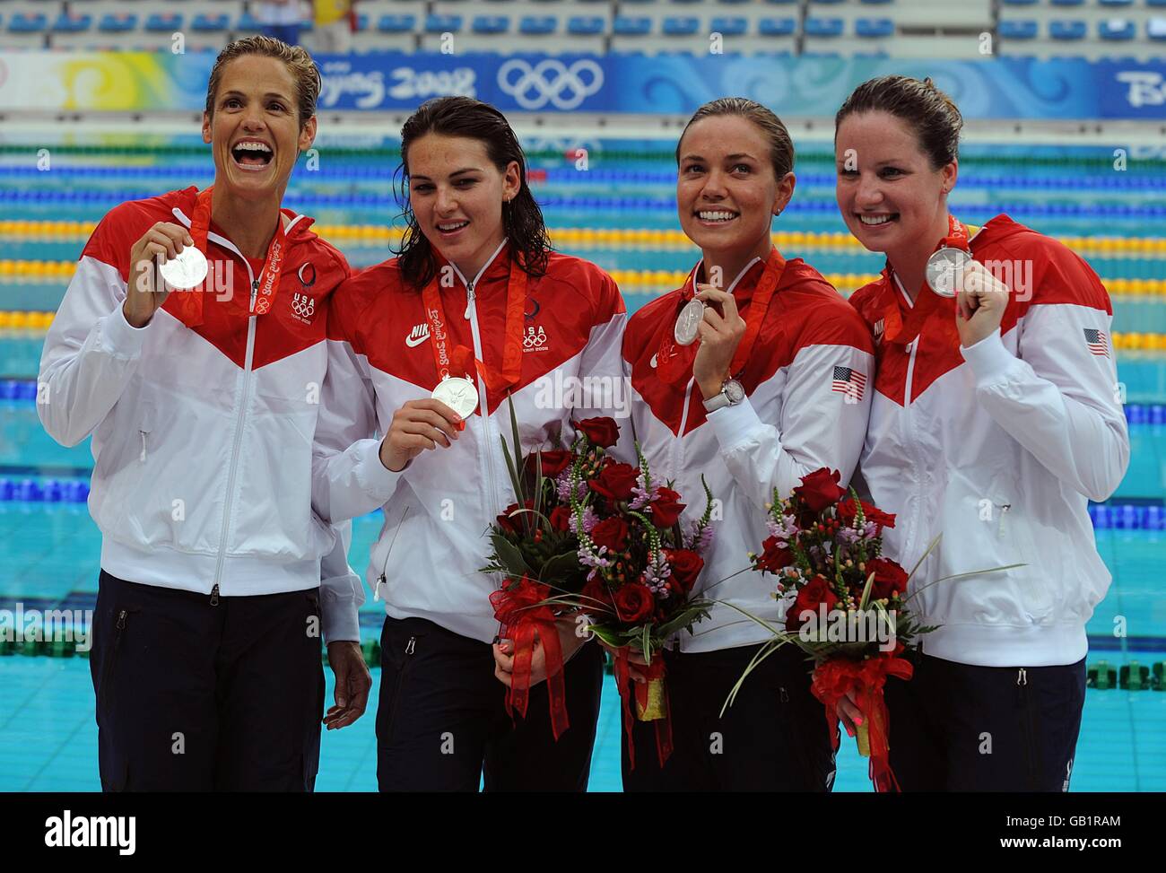 American women's 4x100m relay team with their silver medals. (L-R) Dara Torres, Lacey NyMeyer, Natalie Coughlin and Kara Lynn Joyce. Stock Photo