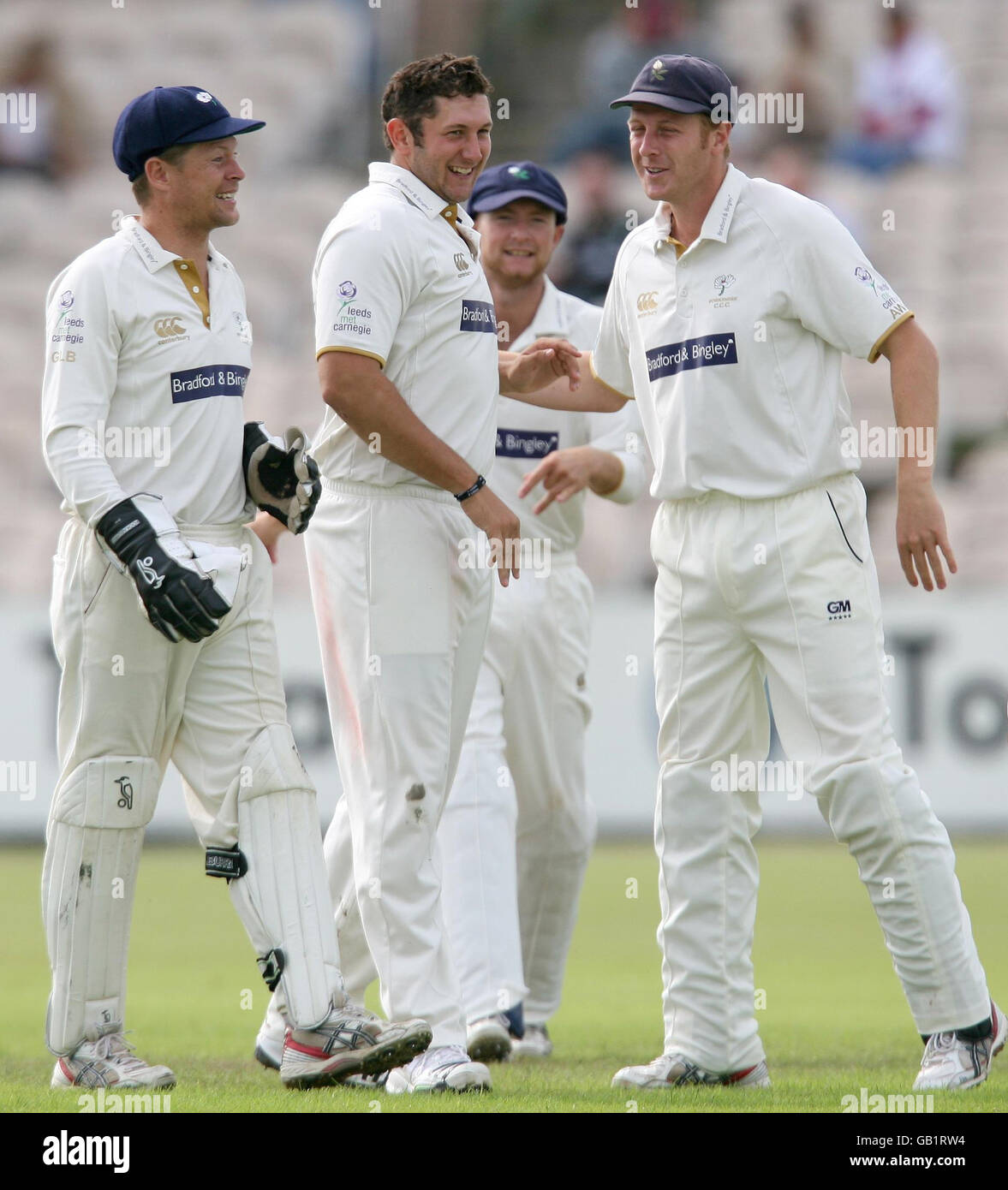 Yorkshire's Tim Bresnan (centre) cellebrates taking the wicket of Lancashire's Stuart Law during the LV County Championship match at Old Trafford Cricket, Manchester. Stock Photo