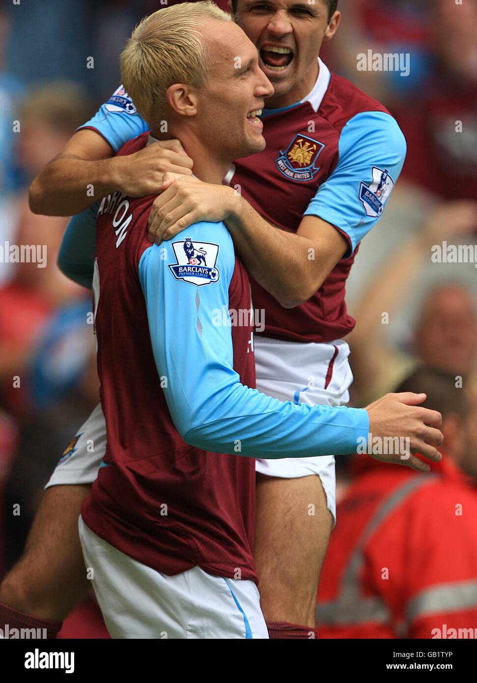 West Ham United's Dean Ashton (l) celebrates scoring his sides first ...
