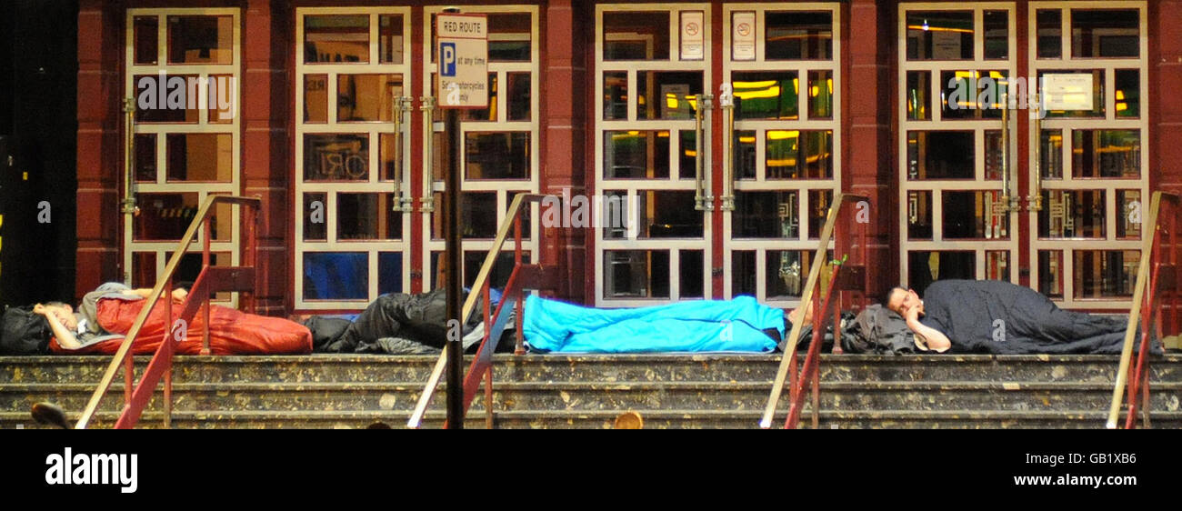 Human Interest - The Homeless - London. Homeless men sleep on the steps of a London theatre. Stock Photo