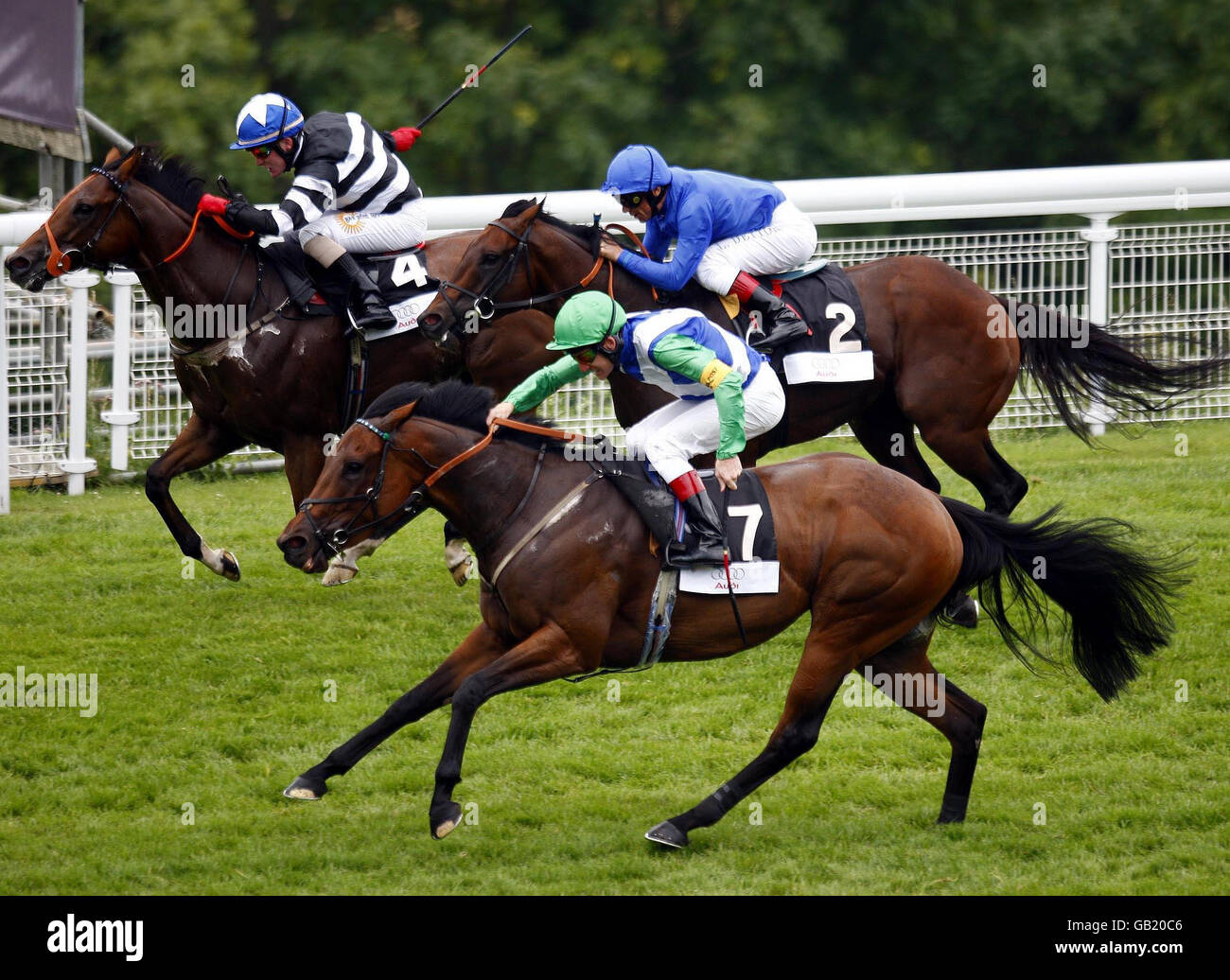 Horse Racing - Glorious Goodwood - Goodwood Cup Day - Goodwood Racecourse. Enticing, ridden by Johnny Murtagh (green cap), goes on to win the Audi stakes at Goodwood Racecourse. Stock Photo