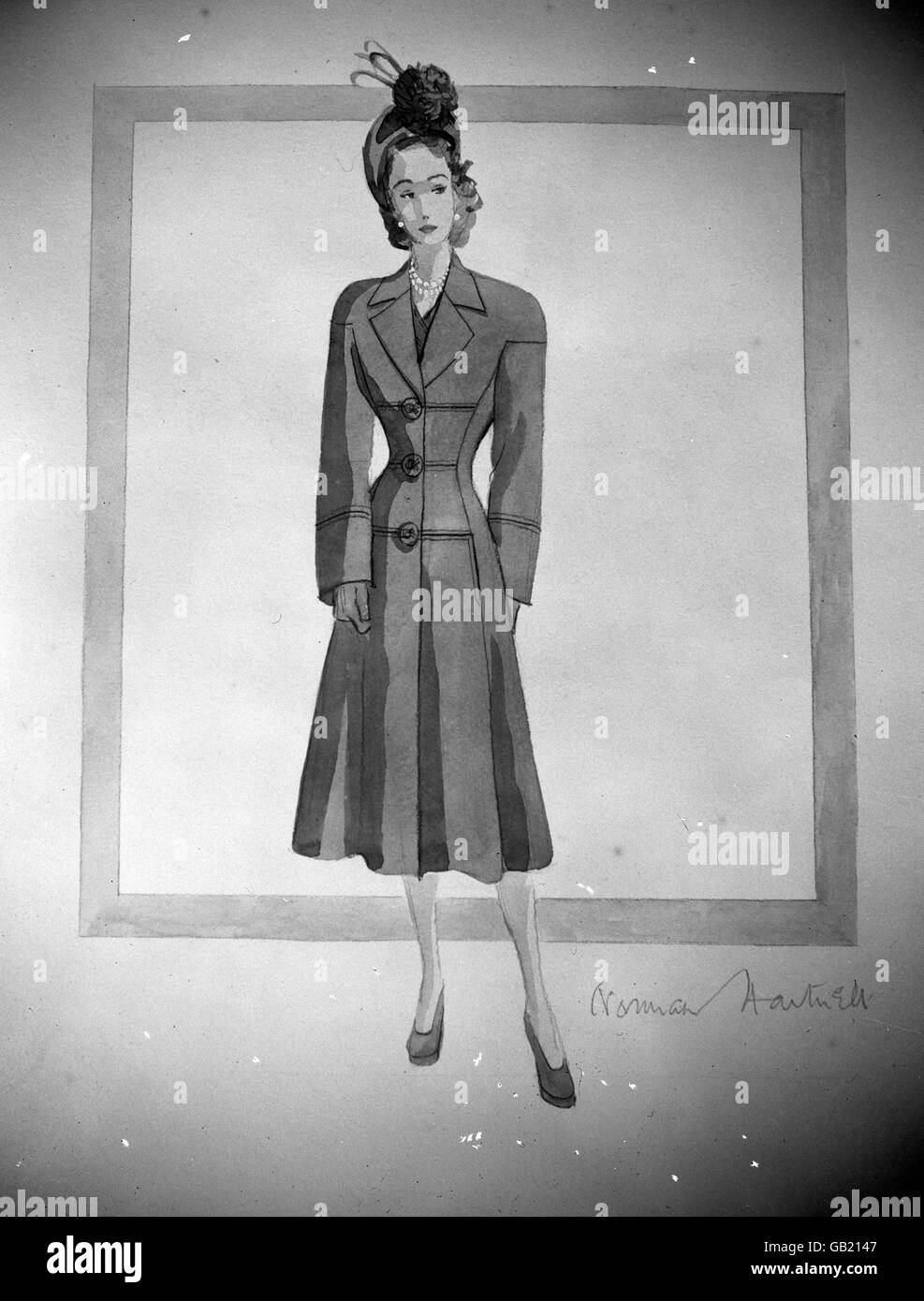 Princess Elizabeth's going away dress designed by Norman Hartnell this travelling coat in love-in-the-mist blue velour cloth with soft revers and rounded shoulders. Stock Photo