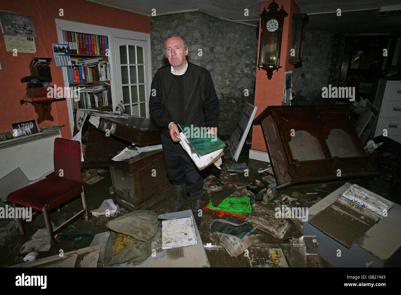 Local Auctioneer Pat O'Donovan surveys the damage to his offices in Newcastle West, Co Limerick after the River Arra burst its banks last night. Stock Photo