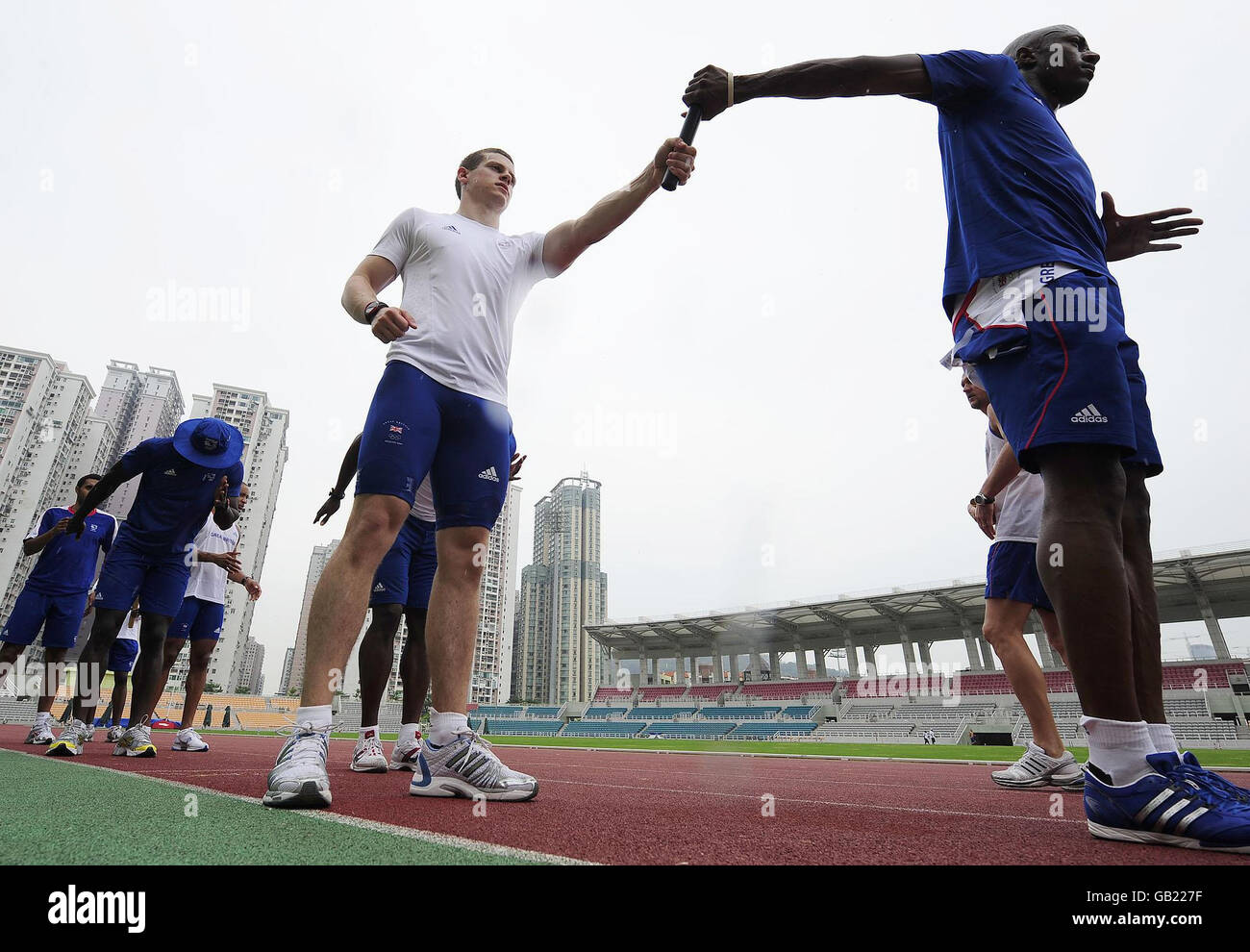 GB Olympic Team sprinters Craig Pickering(centre) and Marlon Devonish take part in Sprint relay squad training today in Macau to complete their preparations for the Beijing Olympics. Stock Photo