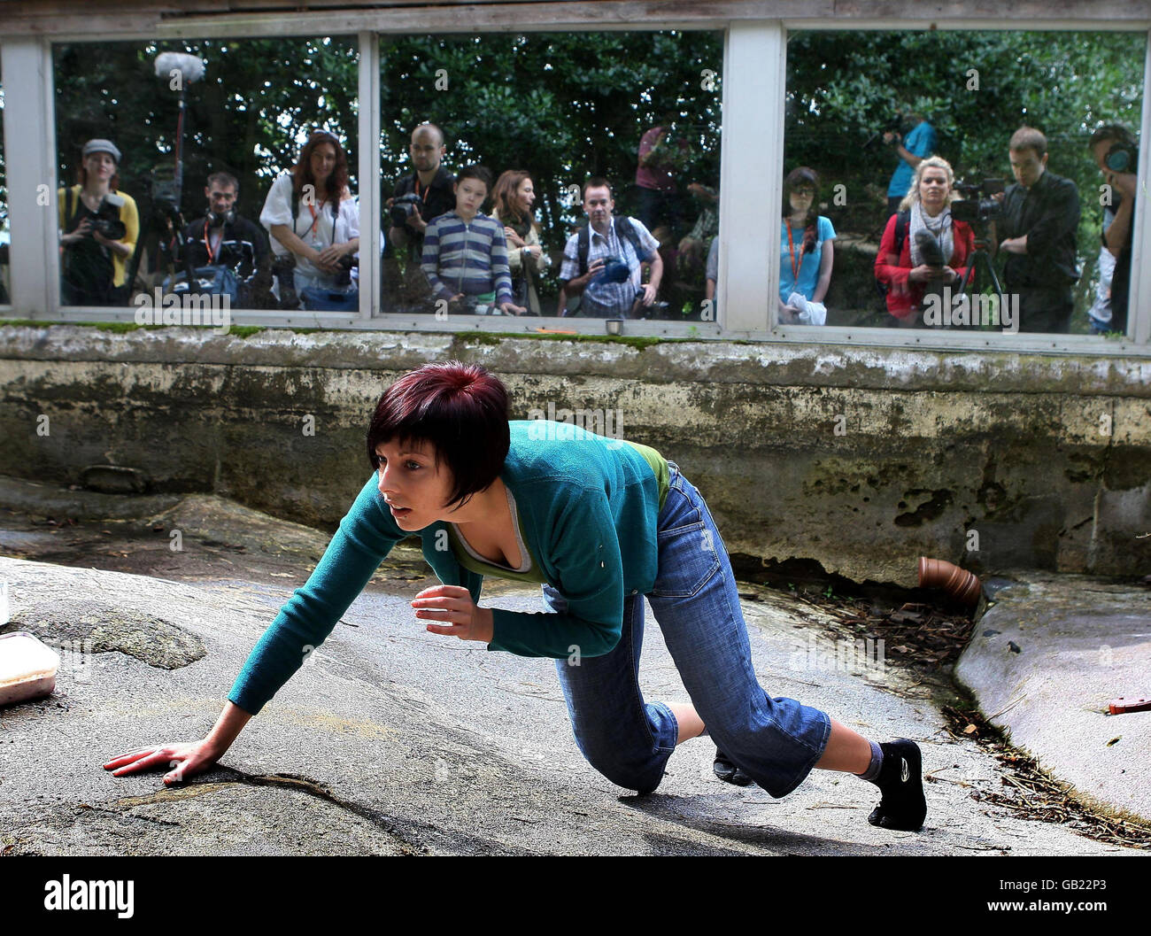 Performers from the Janis Claxton Dance group take part in 'Enclosure 44 - Humans' at Edinburgh Zoo. The Performance event, part of the Dancing Base Fringe Festival, is to highlight the connections between humans and animals, and runs from 5th to 16th August. Stock Photo