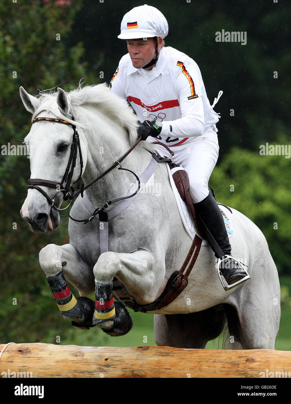 Germany's Hinrich Romeike on Marius at the water jump at fence 5/6 takes part in the cross country section of the Three Day Eventing held at the Shatin Equestrian centre, Hong Kong, during the 2008 Beijing Olympic Games. Stock Photo