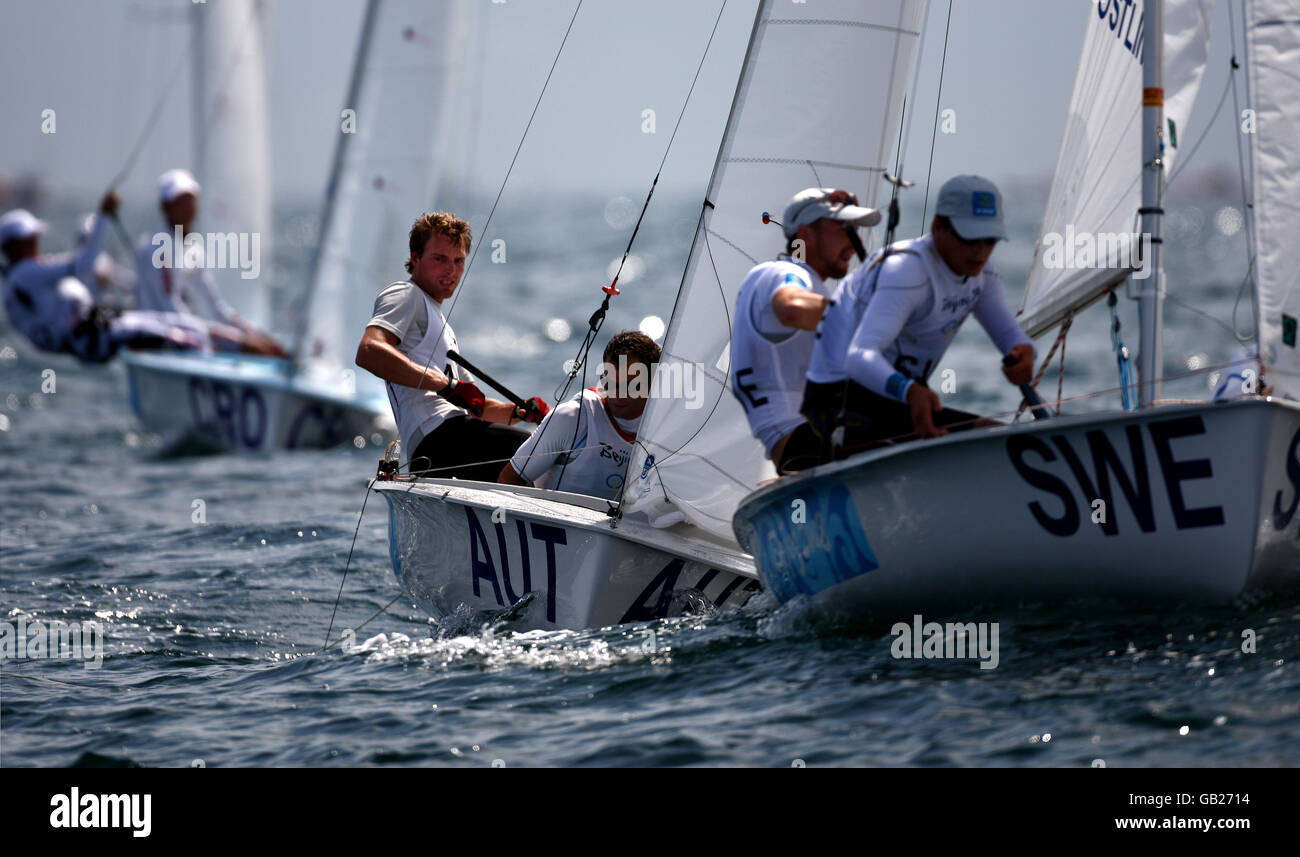 Austria's 470 chase the Sweden team during the opening rounds of their Beijing Olympic competition off Qingdao today. PRESS ASSOCIATION Photos Monday  11th August 2008. Picture credit David Jones/PA Stock Photo