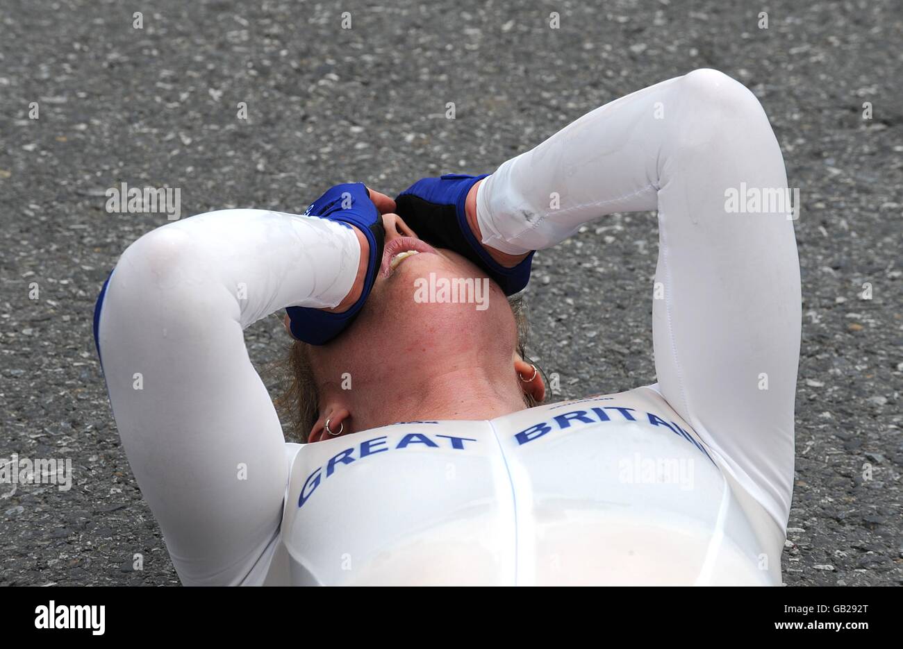 Great Britain's Nicole Cooke collapses exhausted following the the ...