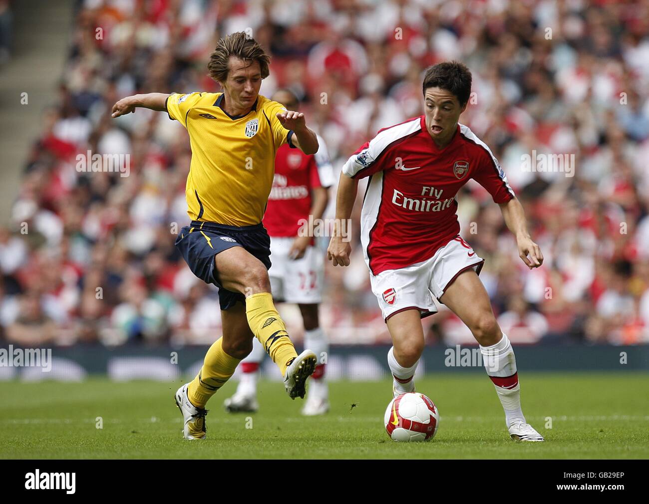 Arsenal's Samir Nasri and West Bromwich Albion's Marek Cech (left) Albion battle for the ball Stock Photo