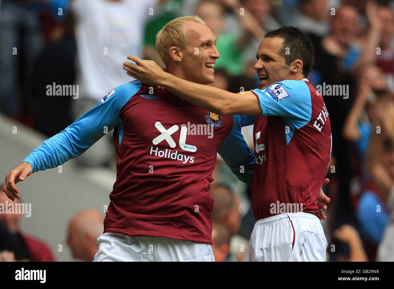 West Ham United's Dean Ashton (l) celebrates scoring his sides first ...