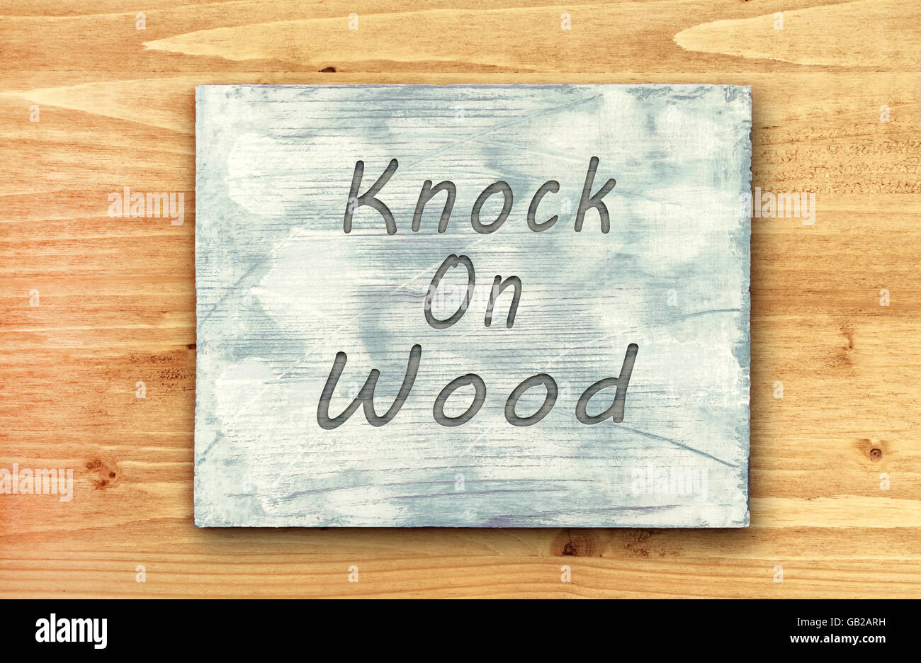 Vintage hipster motivational phrase note, Knock On Wood sign. Stock Photo