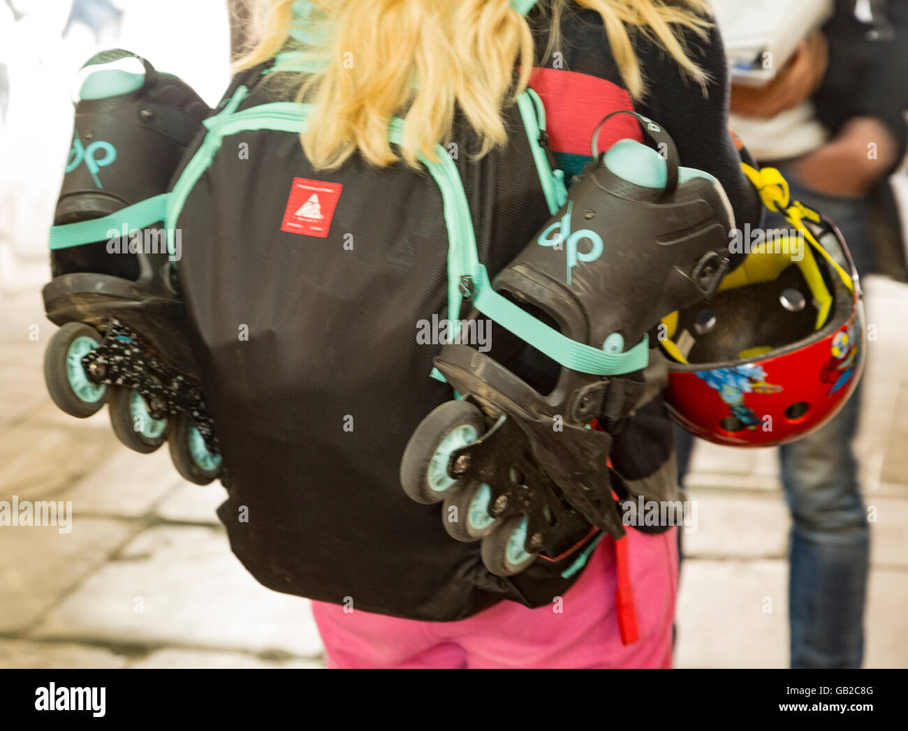 Carrying in line skates and Helmut, Backpack, Hair, Wheels, Stock Photo