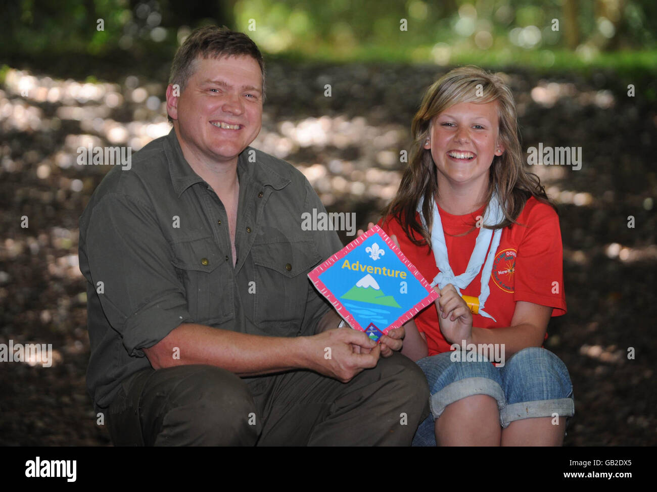 Survival expert Ray Mears poses with Explorer Scout Chloe Marriott, 16, from East Wickham, Welling, at Camp Downe, in Kent, after being awarded his Outdoor Adventure badge. Mears then taught the Scouts some basic survival skills. Stock Photo