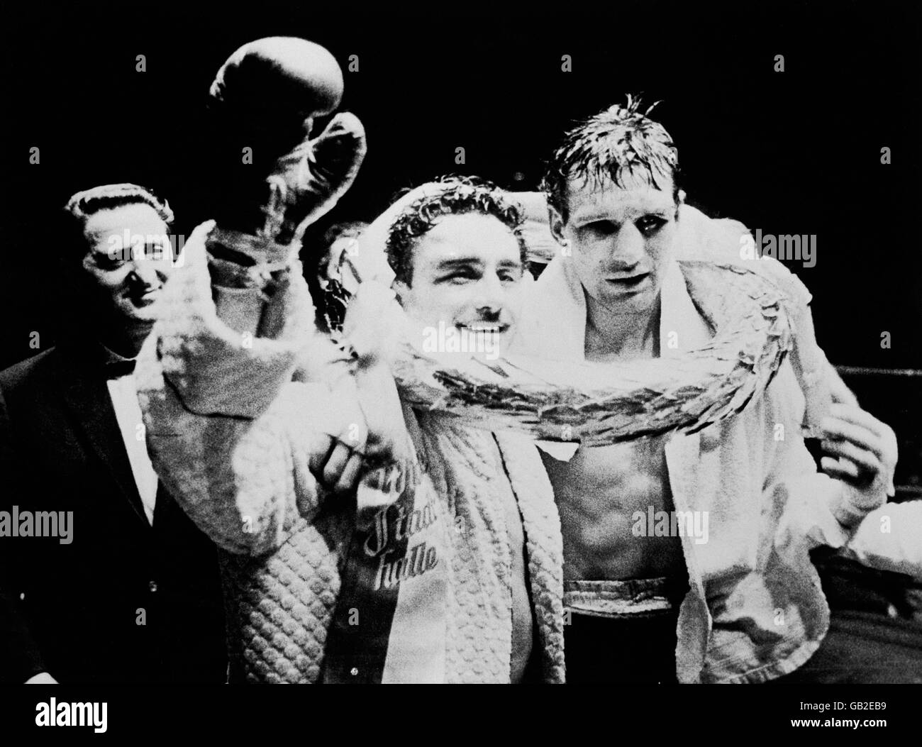 (L-R) Laszlo Papp shares the Championship garland with a battered George Aldridge after retaining his European Championship with a 15th round TKO Stock Photo