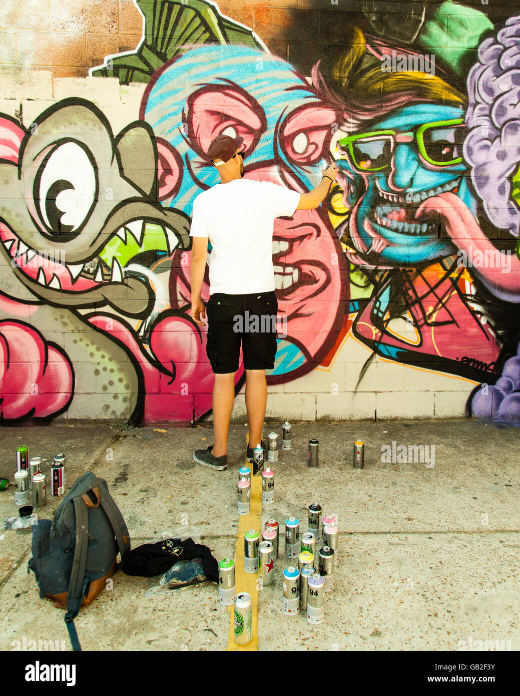 Brighton Graffiti artists painting a wall Stock Photo Alamy