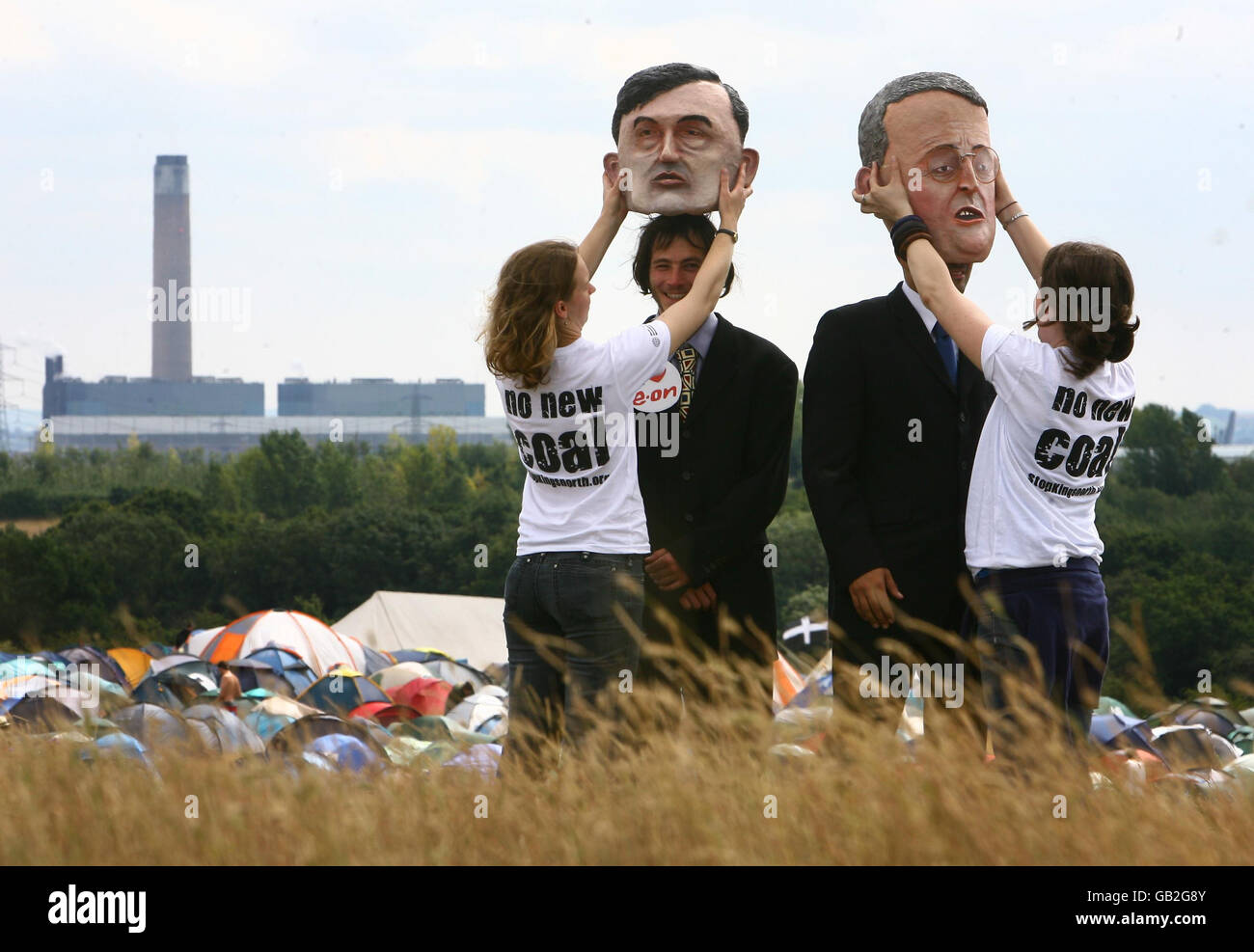 Caricatures of Prime Minister Gordon Brown (left) with Hilary Benn, Minister for the Environment, Food and Rural Affairs are prepared for a photocall at the Climate Camp near Kingsnorth Power Station in Kent, as campaigners protest against the redevelopment of the coal fired power station. Stock Photo