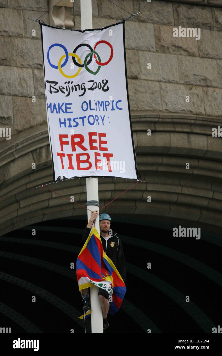 James Murray, 23, a student from Edinburgh University, after climbing up Tower Bridge in central London to unfurl a Tibetan flag. Stock Photo