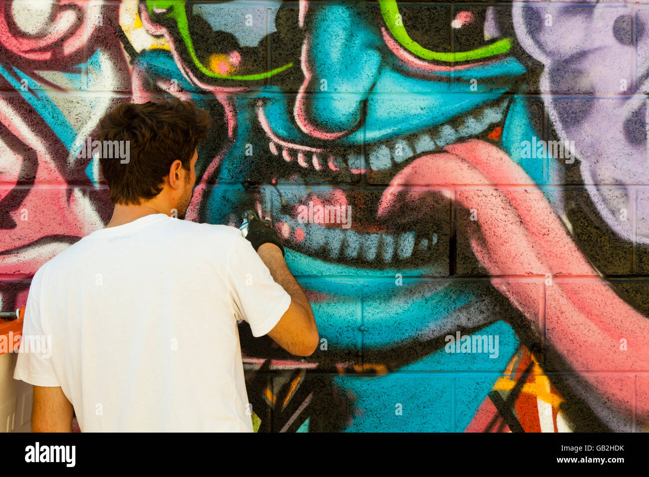 Brighton Graffiti artists painting a wall Stock Photo Alamy