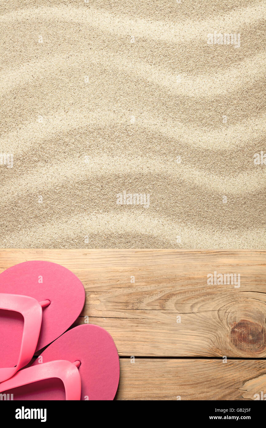 Summer concept with pink flip flops on sandy beach Stock Photo - Alamy