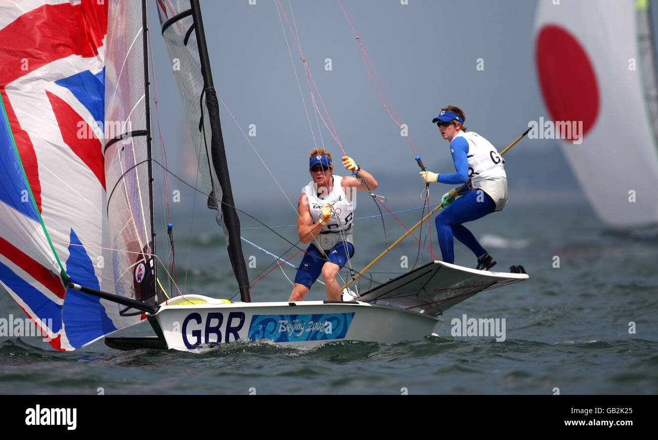 Great Britain's 49er crew Stevie Morrison and Ben Rhodes reset their Spinakker after a gybe during the opening rounds at the 2008 Beijing Olympic Games' sailing centre at Qingdao. Stock Photo