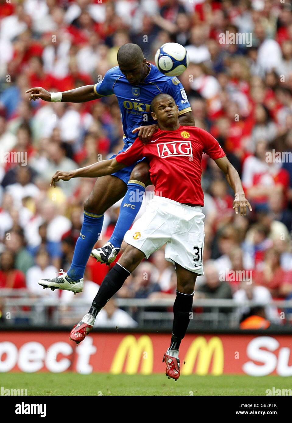 Manchester United's Fraizer Campbell (right) and Portsmouth's Sol ...