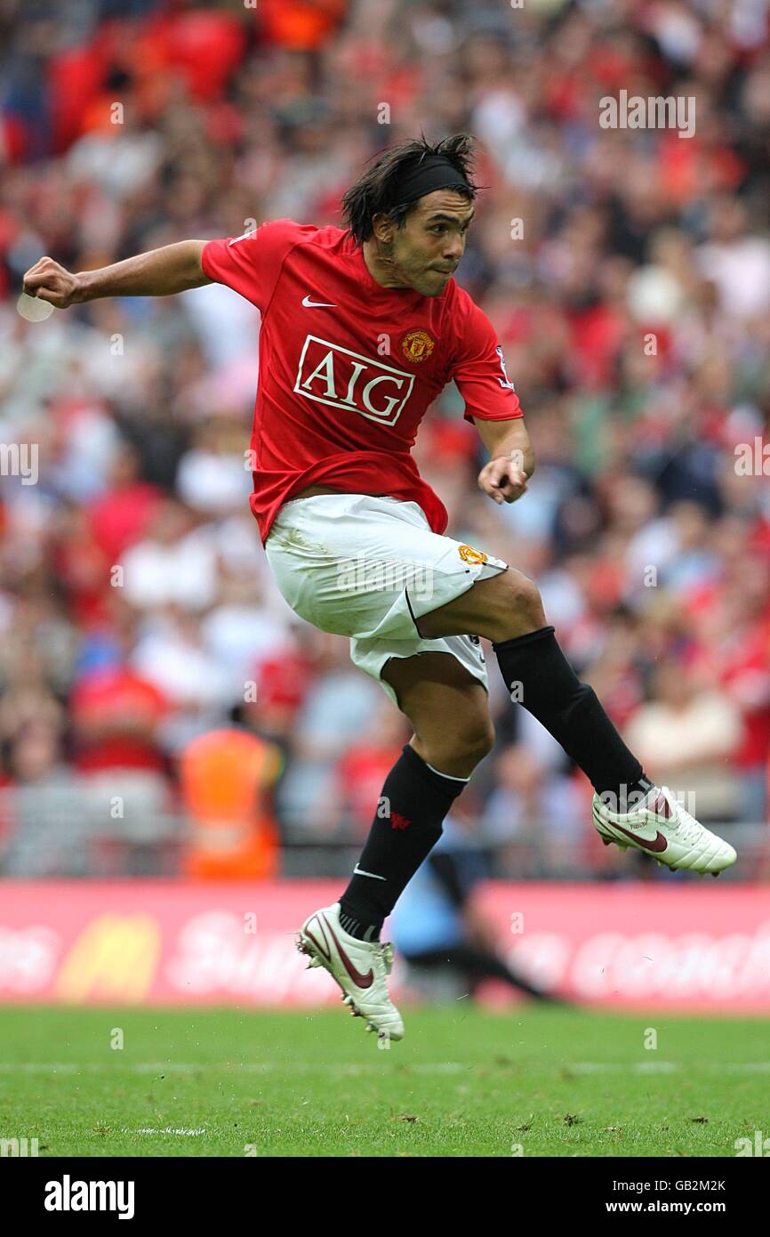 Manchester United's Carlos Tevez scores during the shootout Stock Photo