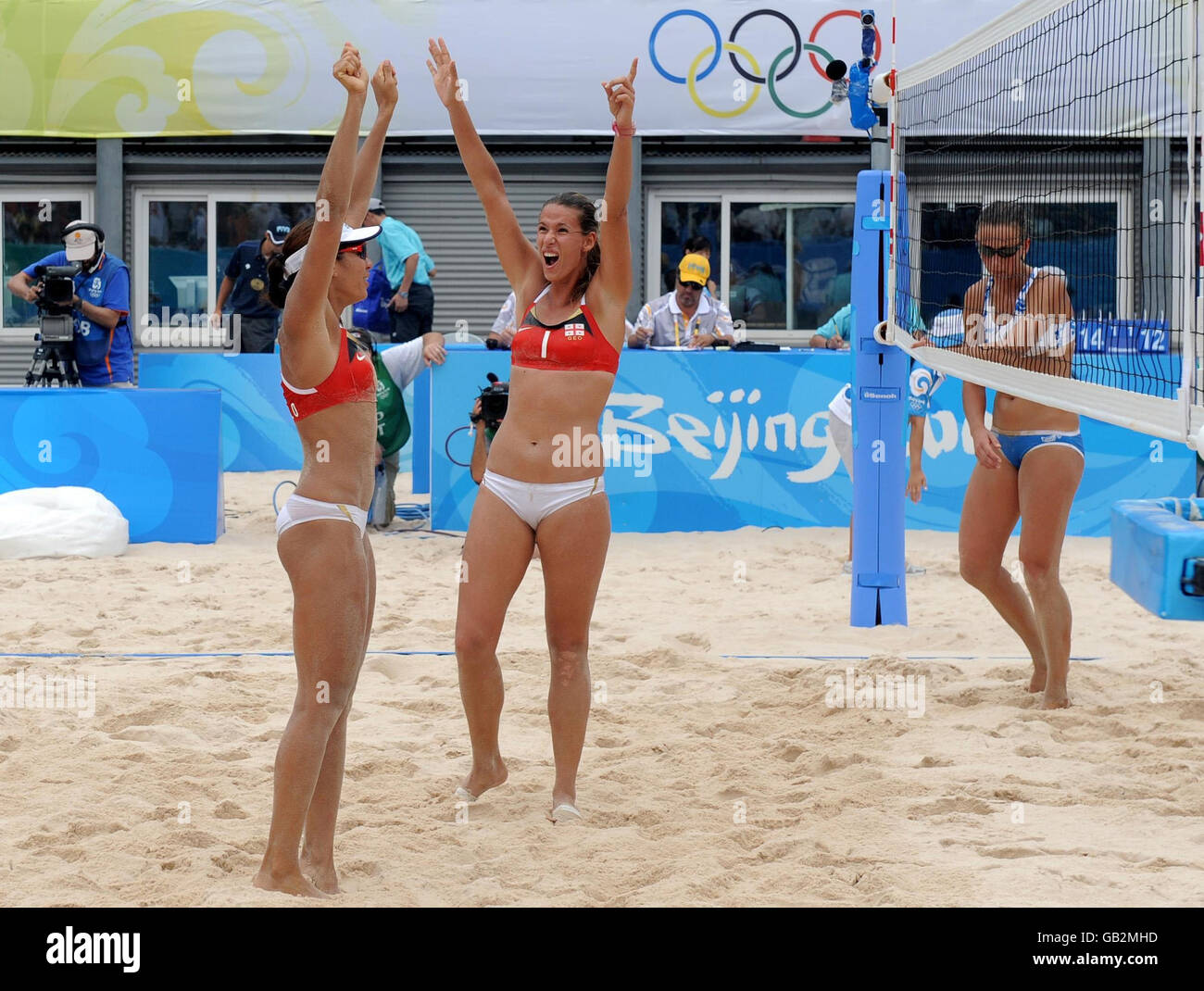 *** RETRANSMITTED Adding restrictions on use*** Georgia's Andrezza Chagas and Cristine Santanna celebrate after beating Russia during the beach volleyball preliminary at Chaoyang Park in Beijing. Stock Photo