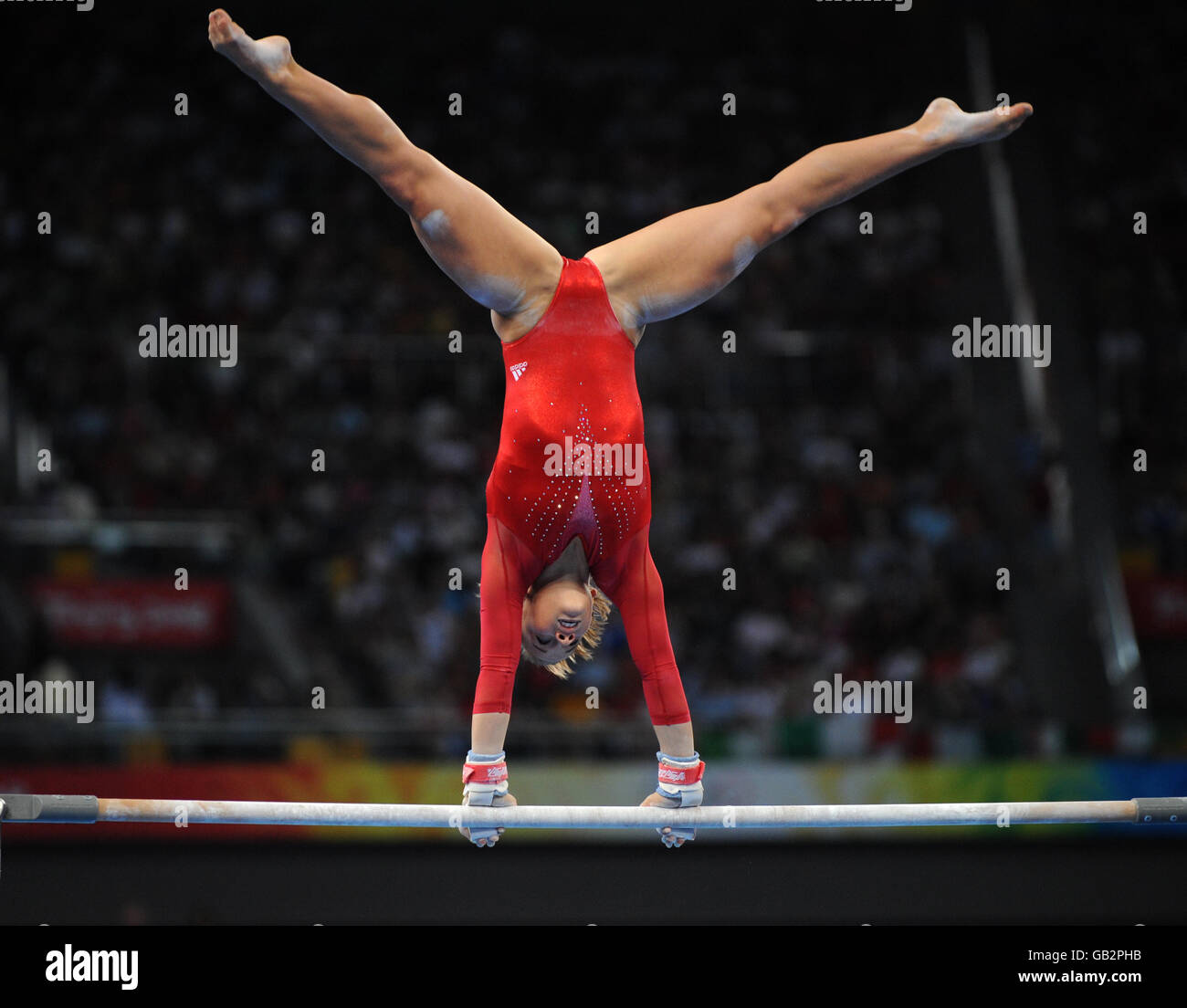 USA's Shawn Johnson in action on the A symmetrical bars in the Women's Individual All Round Final at Beijing's National Indoor Stadium Stock Photo