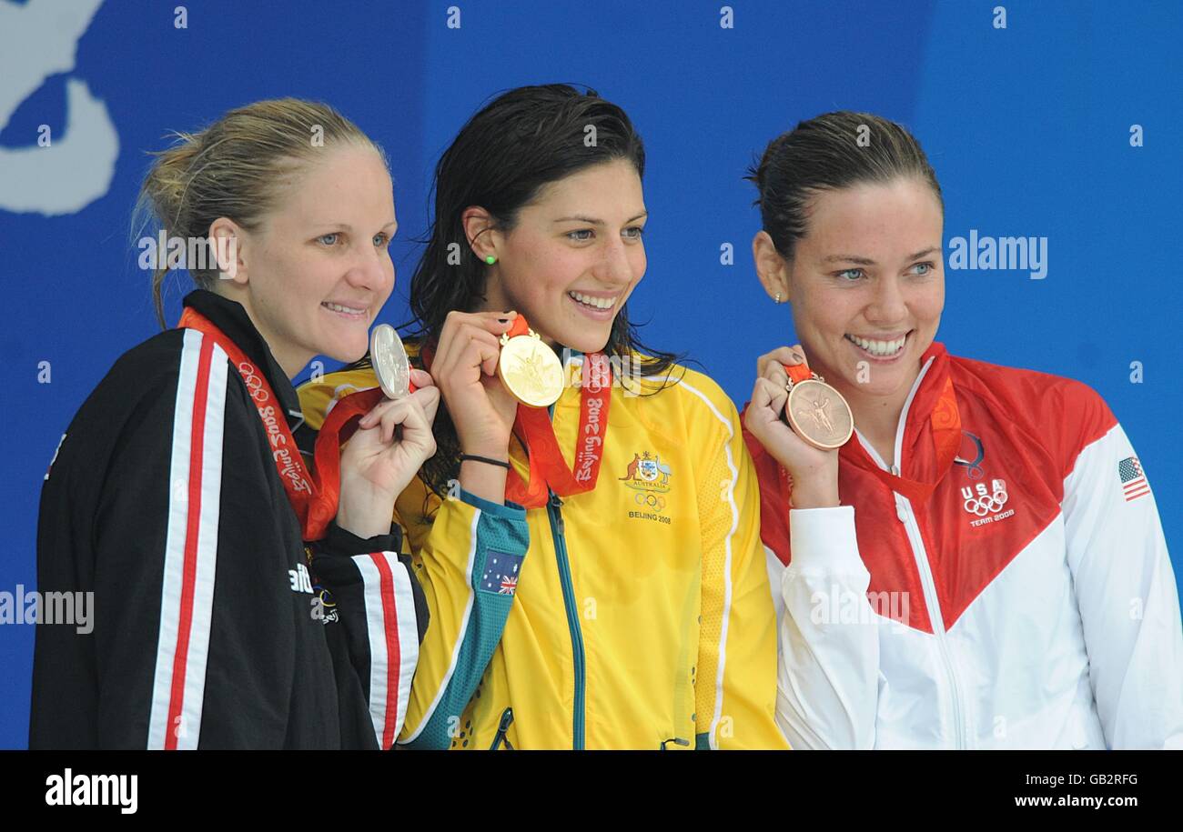 Australia's Stephanie Rice (c), Zimbabwe's Kirsty Coventry (l) and USA's Natalie Coughlin pose with their Gold, Silver and Bronze Medals for the Women's 200m freestyle final at the National Aquatics Center on Day 5 of the 2008 Olympic Games in Beijing. Stock Photo