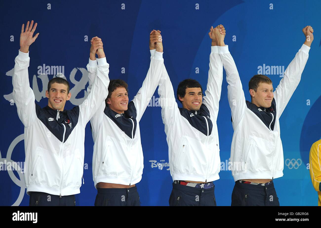 USA's (l-r) Michael Phelps, Ryan Lochte, Ricky Berens and Peter Vanderkaay await to receive their Gold medals for the Men's 4x200m freestyle relay final at the National Aquatics Center on Day 5 of the 2008 Olympic Games in Beijing. Stock Photo